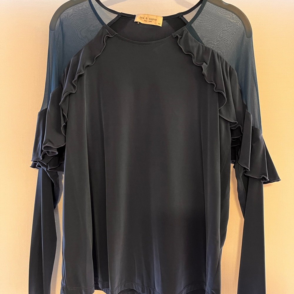 Like new Lola & Sophie women’s top.  Gorgeous shear shoulders with ruffles.